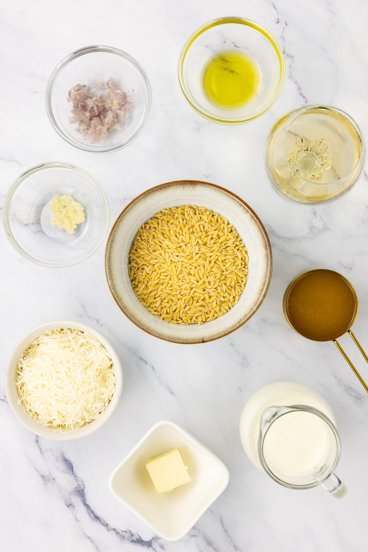 Truffled orzo pasta ingredients on a kitchen table.